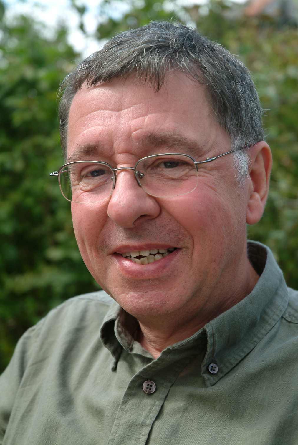 Portrait of a friendly 60 years old man outdoors